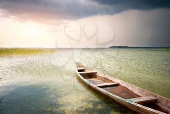Lonely boat on lake. Composition of nature.