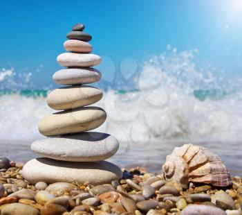 Stone pyramid on a seashore. Relax composition.
