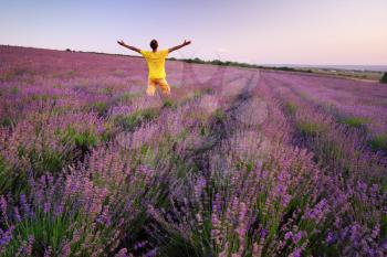 Man in meadow of lavender. Emotional scene.
