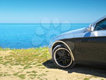 Car on the sea shore. Travel design.