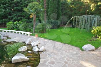 Pathway in garden, Green lawns with bricks pathways, Garden landscape design.