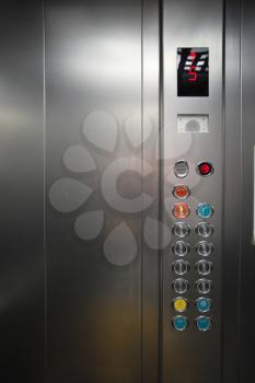 Inside the metal elevator floor selection buttons. Element of design.