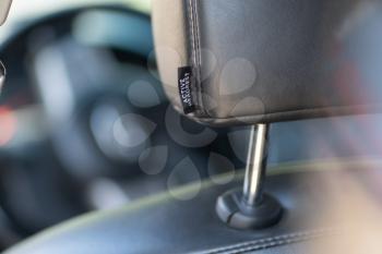 Close-up of leather car headrest. Element of design.