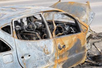 An abandoned, stolen burnt out car