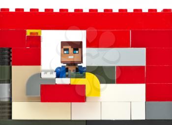 Man in window. Toy construction. Element of design.