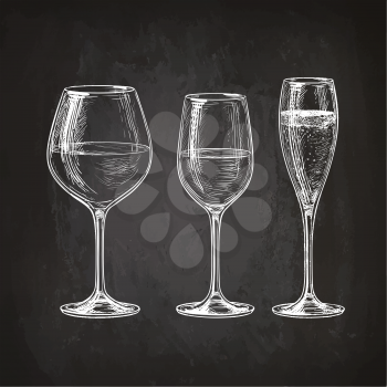 Set of wineglasses. Red wine, white wine and champagne. Hand drawn sketch on chalkboard.