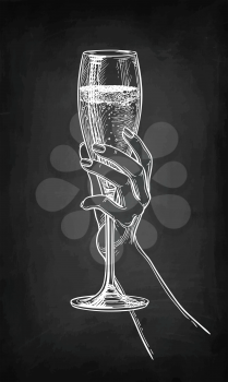 Hand holding a glass of champagne. Chalk sketch on blackboard background. Hand drawn vector illustration. Retro style.