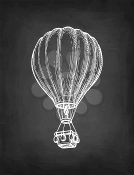 Hot air balloon. Chalk sketch of aerostat on blackboard background. Hand drawn vector illustration. Retro style.