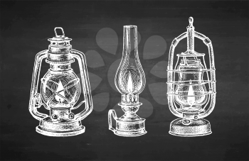 Burning kerosene lamps. Antique oil lantern. Chalk sketch on blackboard background. Hand drawn vector illustration. Retro style.