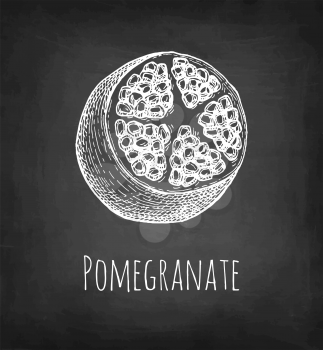 Pomegranate sliced in half. Chalk sketch on blackboard background. Hand drawn vector illustration. Retro style.