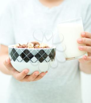Hands with milk and flakes, dairy product