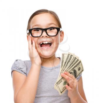 Cute girl with dollars, isolated over white