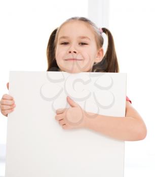 Little girl is holding blank banner