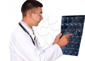 Young male doctor looking at tomography brain , isolated over white