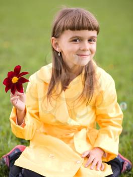 Little beautiful girl with flower