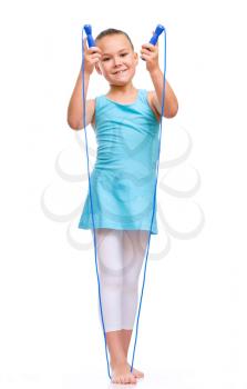 Young sporty girl with skipping rope, isolated over white