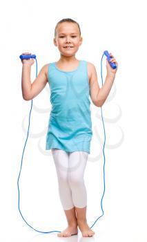 Young sporty girl with skipping rope, isolated over white
