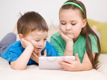 Happy children using tablet computer