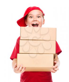 Happy girl holding cardboard boxes, delivery of goods, isolated over white