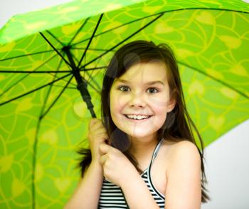 Beautiful young girl with umbrella