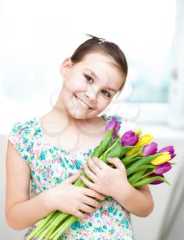 Portrait of the girl with flowers. Spring holiday concept