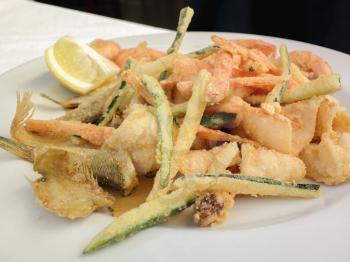 Hot and cold snacks from barnacles, fish and shrimp. The Mediterranean cuisine of Italy.
