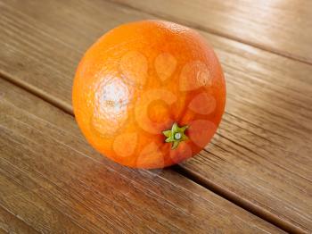 Fruit closeup on wooden vintage table. Orange.