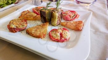 Meat and vegetable snacks. Aperitifs. Mediterranean cuisine on a white tablecloth in an Italian restaurant.