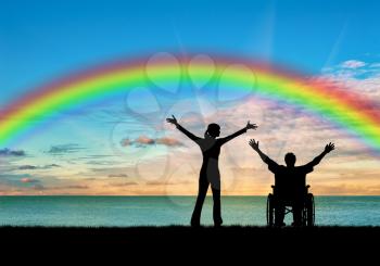 Disabled concept. A disabled person with a nurse, happy rainbow and sea sunset