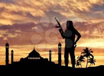 Terrorism and conflict. Armed terrorists near the mosque at sunset