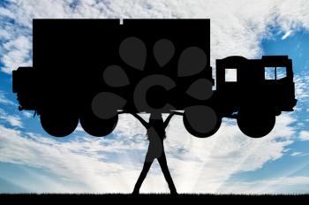 Silhouette of strong feminist, lifting trucks. Concept of feminism.