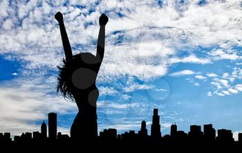 Silhouette of the happy woman on a background of cityscape day