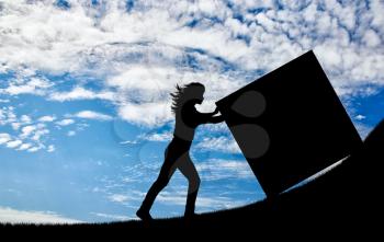 Silhouette of a strong woman pushing a cube to the top. Concept of effort and difficulties