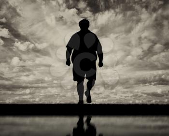 Thick man and a reflection in water black white. Concept obesity