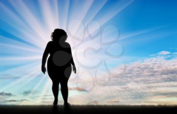 Fat woman standing on background sky. Concept obesity