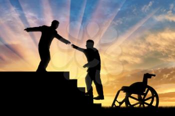 Man gives helping hand to disabled person in wheelchair sunset. Concept assistance disabled persons