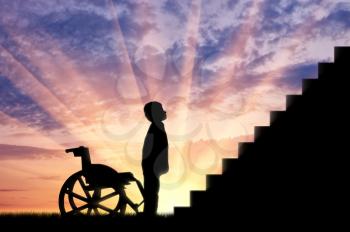 Disabled child standing in front of stairs sunset. Concept disabled child