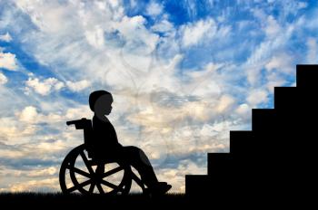 Disabled child sitting in wheelchair front of stairs day. Disabled children concept