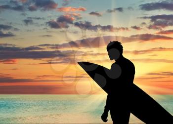 Sports concept. Silhouette of a surfer on the beach at sunset sea background
