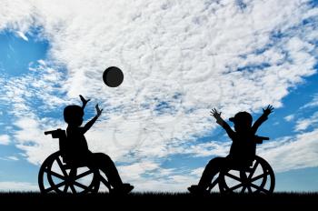 Happy children disabilities in wheelchair play ball day. Concept happy children disabilities