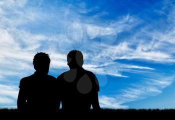 Concept of gay people. Silhouette of two gay men resting against the blue sky