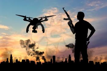 Silhouette flying reconnaissance drone over city in a smoke and a terrorist. Concept of military intelligence and terrorist information