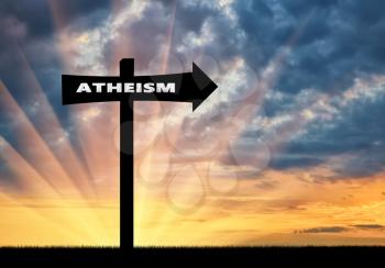 Atheism concept. Road sign of atheism at sunset