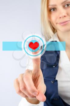  Woman presses the touch heart icon. On a light background