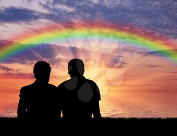 Homosexuals. Gay Couple near the sea with a rainbow at sunset