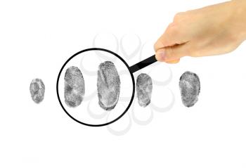 Security Concept. Examination of fingerprints under a magnifying glass