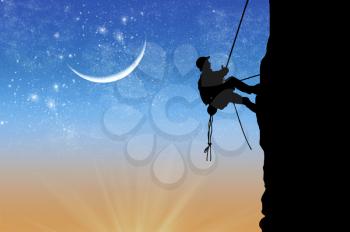Concept of sport climber. Silhouette of climber at the sunset on the background of the moon and stars