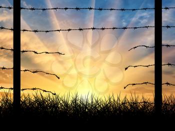 Illegal immigration. Silhouette of a broken border fence with barbed wire