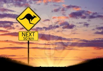 Silhouette of a kangaroo road sign on the background of a beautiful sunset