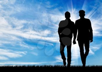 Silhouette of two gay men walking holding hands